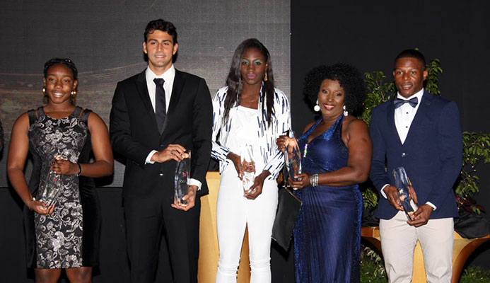 From left, Keona Yorke, sister of swimmer Kael Yorke, swimmer Dylan Carter, Shanique Bascombe, Yvette Wilson, mother of Jereem Richards and Nicholas Paul pose with their awards at the TTOC’s annual Awards, held yesterday at the Hyatt Regency Hotel, Port of Spain. From left, Keona Yorke, sister of swimmer Kael Yorke, swimmer Dylan Carter, Shanique Bascombe, Yvette Wilson, mother of Jereem Richards and Nicholas Paul pose with their awards at the TTOC’s annual Awards, held yesterday at the Hyatt Regency Hotel, Port of Spain.
