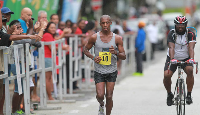 Curtis Cox heads to the finish-line. He was the first T&T runner to finish in a time of 2:53:43 out at the Queen’s Park Savannah, Port-of-Spain, yesterday. Curtis Cox heads to the finish-line. He was the first T&T runner to finish in a time of 2:53:43 out at the Queen’s Park Savannah, Port-of-Spain, yesterday.