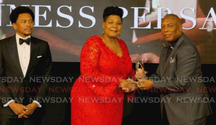 President Paula-Mae Weekes (centre) presents the Alexander B Chapman Award to NAAA president Ephraim Serrette (right), on behalf of veteran track and field coach Gunness Persad, at the TTOC award ceremony, at the Hyatt Regency Hotel, Port of Spain on Sunday. Also in photo is TTOC president Brian Lewis. PHOTO BY ROGER JACOB. - ROGER JACOB President Paula-Mae Weekes (centre) presents the Alexander B Chapman Award to NAAA president Ephraim Serrette (right), on behalf of veteran track and field coach Gunness Persad, at the TTOC award ceremony, at the Hyatt Regency Hotel, Port of Spain on Sunday. Also in photo is TTOC president Brian Lewis. PHOTO BY ROGER JACOB. - ROGER JACOB