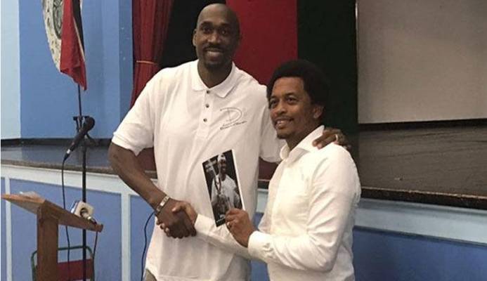 SHARING HIS EXPERIENCE: In this flashback photo, former pro basketballer Kibwe Trim, left, presents a copy of his book to TTOC president Brian Lewis at Trim’s alma mater, St Mary’s College, in 2017. SHARING HIS EXPERIENCE: In this flashback photo, former pro basketballer Kibwe Trim, left, presents a copy of his book to TTOC president Brian Lewis at Trim’s alma mater, St Mary’s College, in 2017.