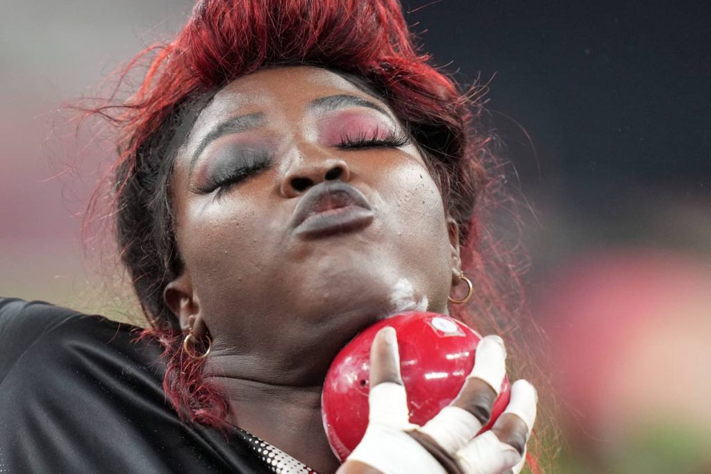 Portious Warren, of Trinidad and Tobago, competes in the qualification rounds of the women's shot put at the 2020 Summer Olympics, Friday, in Tokyo. (AP Photo) - Portious Warren, of Trinidad and Tobago, competes in the qualification rounds of the women's shot put at the 2020 Summer Olympics, Friday, in Tokyo. (AP Photo) -