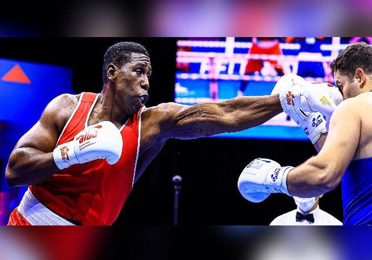 TAKE THAT: Trinidad and Tobago’s  super-heavyweight Nigel Paul lands a straight left flush to the face of Turkey’s Berat Acar during their quarter-final clash at the 2021 AIBA World Boxing Championships in Belgrade, Serbia, yesterday. Paul won the encounter 4-1 to advance to the medal round. —Photo courtesy AIBA TAKE THAT: Trinidad and Tobago’s  super-heavyweight Nigel Paul lands a straight left flush to the face of Turkey’s Berat Acar during their quarter-final clash at the 2021 AIBA World Boxing Championships in Belgrade, Serbia, yesterday. Paul won the encounter 4-1 to advance to the medal round. —Photo courtesy AIBA