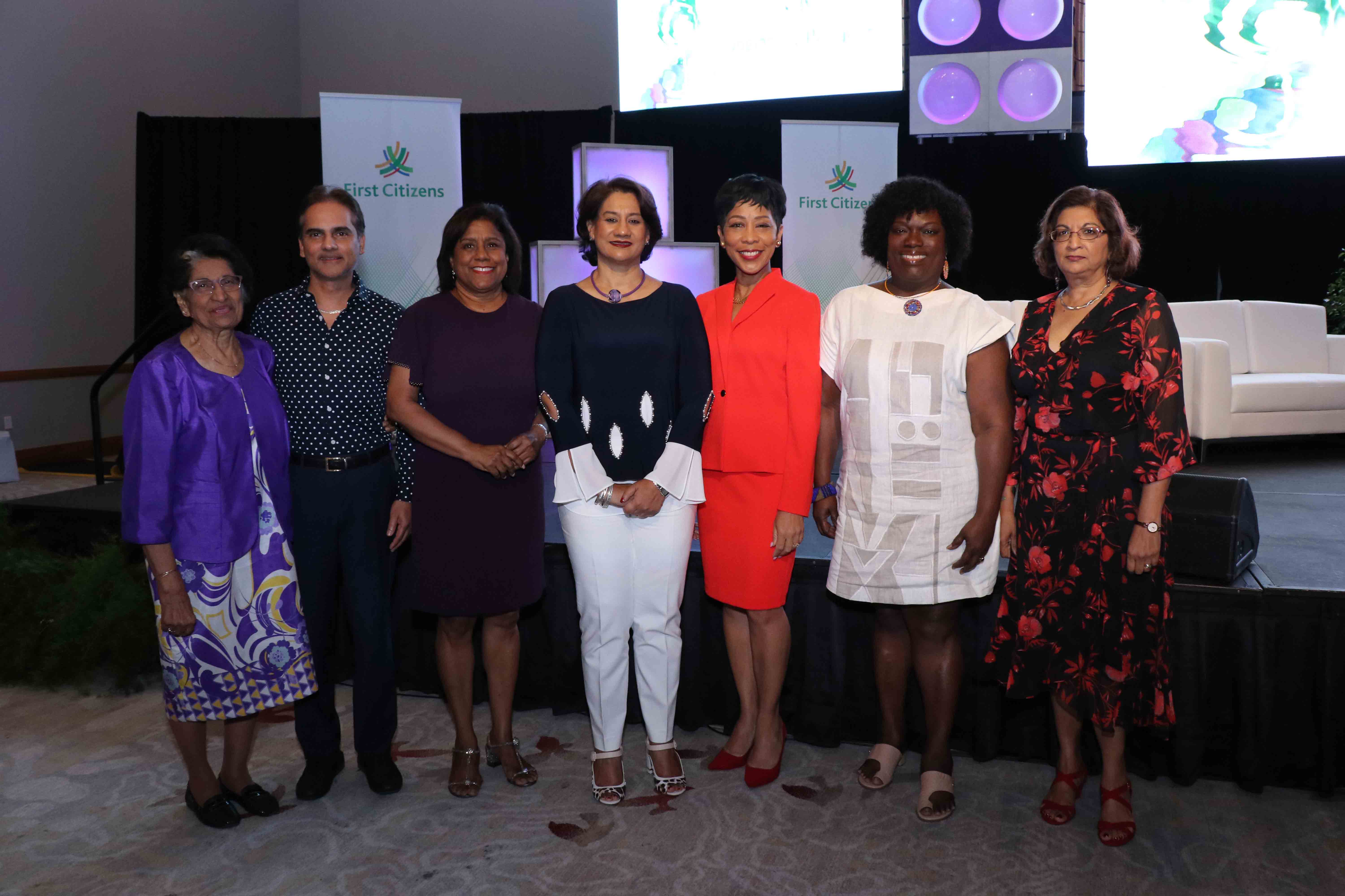 Zalayhar Hassanali, Former First Lady; Professor Sterling Frost, First Citizens Group Deputy CEO – Operations & Administration; Senator the Honourable Paula Gopee-Scoon, Minister of Trade and Industry; Karen Darbasie, First Citizens Group CEO; Sharon Clark-Rowley, wife of Dr. the Honourable Keith Rowley and Attorney-at-Law; Her Honour Deborah Thomas-Felix, President of the Industrial Court; and Emerita Professor Patricia Mohammed at the annual First Citizens Women First Conference. Zalayhar Hassanali, Former First Lady; Professor Sterling Frost, First Citizens Group Deputy CEO – Operations & Administration; Senator the Honourable Paula Gopee-Scoon, Minister of Trade and Industry; Karen Darbasie, First Citizens Group CEO; Sharon Clark-Rowley, wife of Dr. the Honourable Keith Rowley and Attorney-at-Law; Her Honour Deborah Thomas-Felix, President of the Industrial Court; and Emerita Professor Patricia Mohammed at the annual First Citizens Women First Conference.