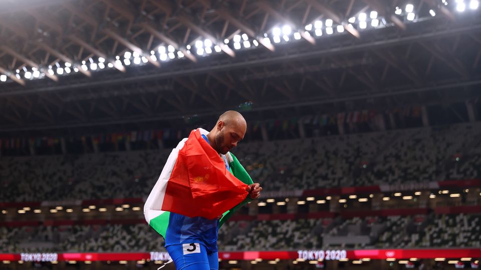Tokyo 2020 Olympics - Athletics - Men's 100m - Final - OLS - Olympic Stadium, Tokyo, Japan - August 1, 2021. Lamont Marcell Jacobs of Italy celebrates after winning gold REUTERS/Andrew Boyers Tokyo 2020 Olympics - Athletics - Men's 100m - Final - OLS - Olympic Stadium, Tokyo, Japan - August 1, 2021. Lamont Marcell Jacobs of Italy celebrates after winning gold REUTERS/Andrew Boyers