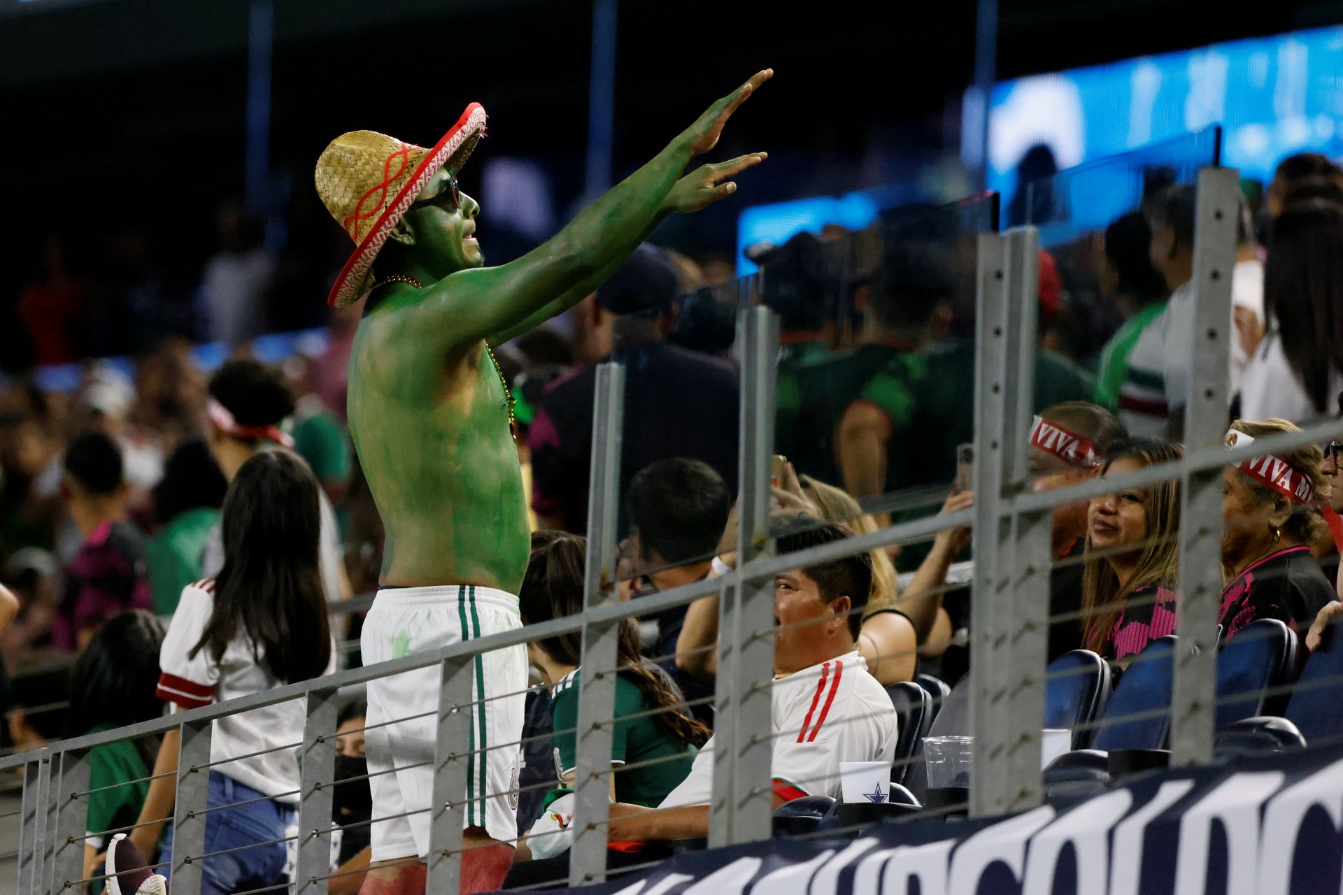 A Mexico fan tries to calm down the crowd, which was threatened with a suspended game as Mexico played to a 0-0 draw against Trinidad and Tobago, during the second half of a CONCACAF Gold Cup Group A soccer match in Arlington, Texas,USA on Saturday. (AP Photo/Michael Ainsworth)  Michael Ainsworth A Mexico fan tries to calm down the crowd, which was threatened with a suspended game as Mexico played to a 0-0 draw against Trinidad and Tobago, during the second half of a CONCACAF Gold Cup Group A soccer match in Arlington, Texas,USA on Saturday. (AP Photo/Michael Ainsworth)  Michael Ainsworth