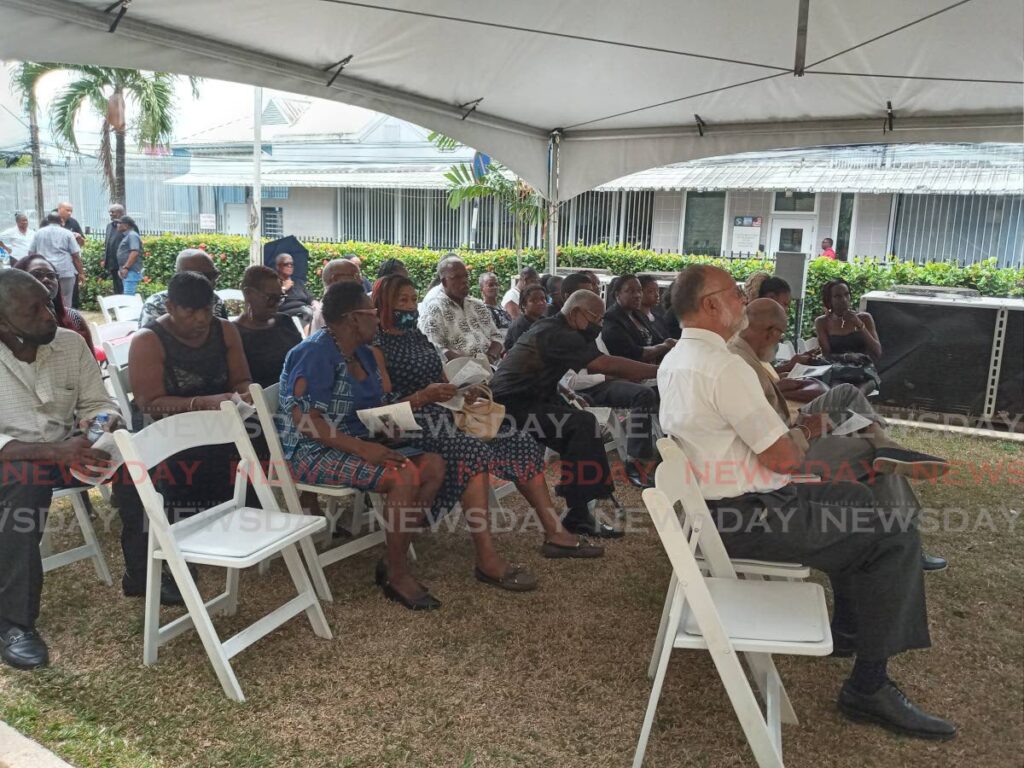 Mourners view the funeral of Verna Edwards on a screen outside All Saints Anglican Church, Queen’s Park West, on Friday. - Jelani Beckles (Image obtained at newsday.co.tt) Mourners view the funeral of Verna Edwards on a screen outside All Saints Anglican Church, Queen’s Park West, on Friday. - Jelani Beckles (Image obtained at newsday.co.tt)