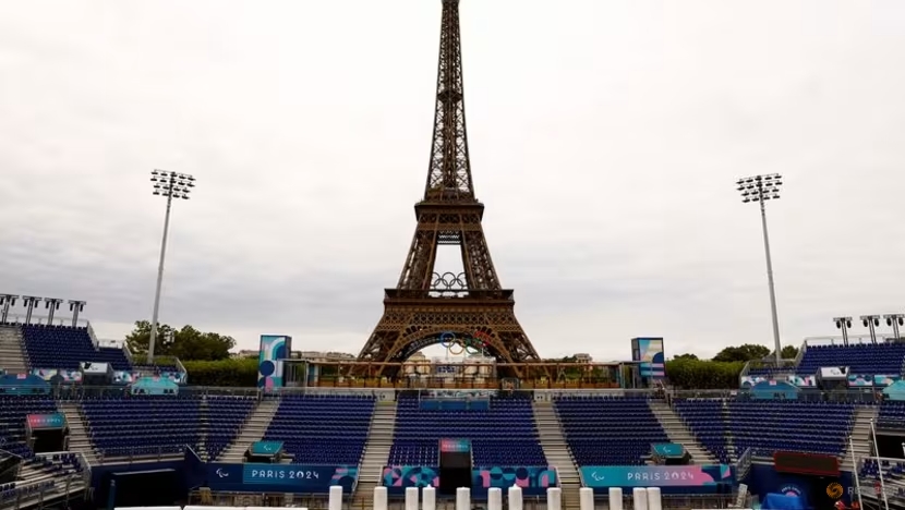 FILE PHOTO: Paris 2024 Paralympics - Paris, France - August 18, 2024 Workers work to convert the Eiffel Tower Stadium from the beach volleyball venue to the Paralympic blind football venue for the coming Paris 2024 Paralympic Games REUTERS/Abdul Saboor/File Photo (Image obtained at channelnewsasia.com) FILE PHOTO: Paris 2024 Paralympics - Paris, France - August 18, 2024 Workers work to convert the Eiffel Tower Stadium from the beach volleyball venue to the Paralympic blind football venue for the coming Paris 2024 Paralympic Games REUTERS/Abdul Saboor/File Photo (Image obtained at channelnewsasia.com)