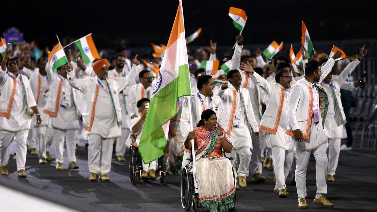 Paris 2024 Paralympics: Flagbearers Bhagyashri Mahavrao Jadhav and Sumit Antil lead the Indian contingent during the Opening Ceremony on Wednesday. | Photo Credit: REUTERS (Image obtained at sportstar.thehindu.com) Paris 2024 Paralympics: Flagbearers Bhagyashri Mahavrao Jadhav and Sumit Antil lead the Indian contingent during the Opening Ceremony on Wednesday. | Photo Credit: REUTERS (Image obtained at sportstar.thehindu.com)