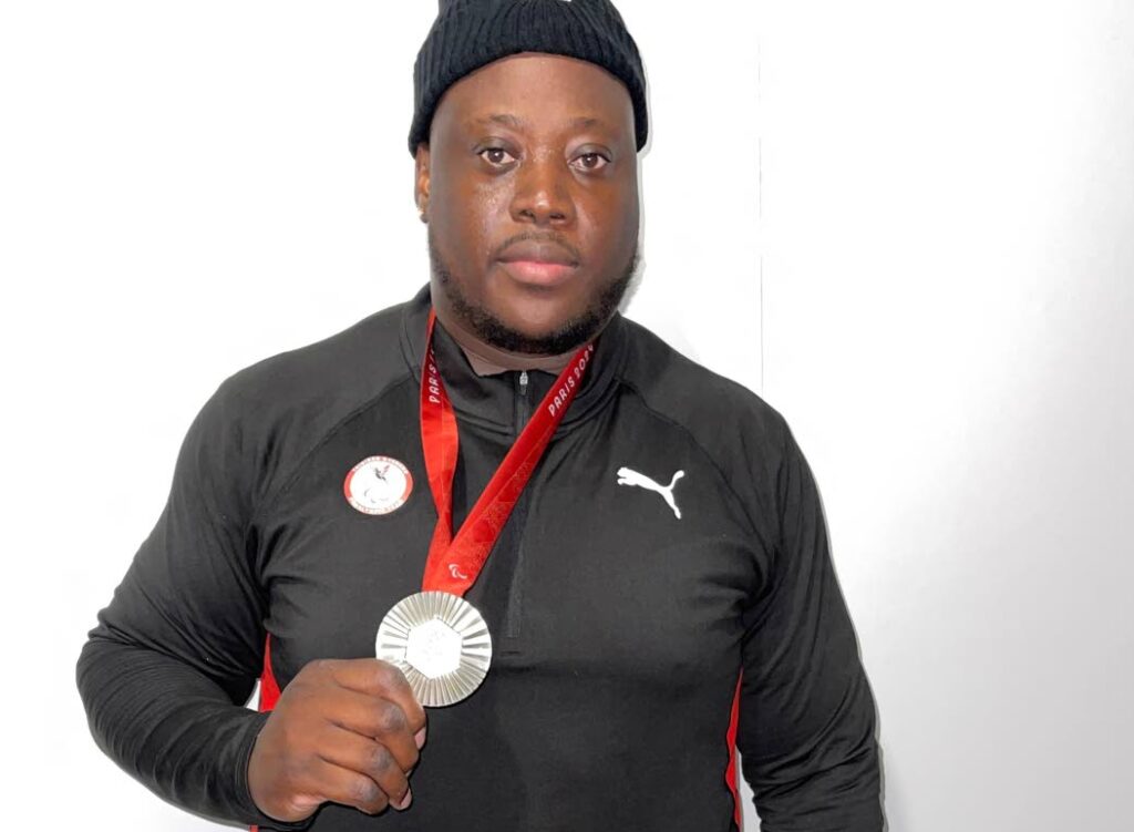 Trinidad and Tobago's Akeem Stewart displays his Paralympic Games men's discus F64 silver medal at the Stade de France on September 5. - Photo courtesy TT Paralympic Committee (Image obtained at newsday.co.tt) Trinidad and Tobago's Akeem Stewart displays his Paralympic Games men's discus F64 silver medal at the Stade de France on September 5. - Photo courtesy TT Paralympic Committee (Image obtained at newsday.co.tt)