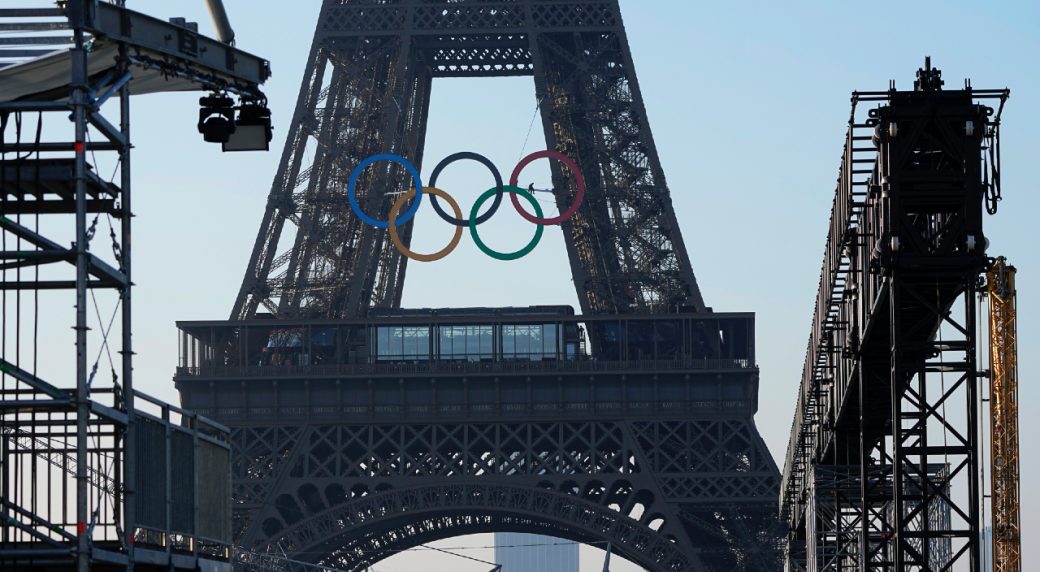 The Olympic rings are seen on the Eiffel Tower Friday, June 7, 2024 in Paris. The Paris Olympics organizers mounted the rings on the Eiffel Tower on Friday as the French capital marks 50 days until the start of the Summer Games. The 95-foot-long and 43-foot-high structure of five rings, made entirely of recycled French steel, will be displayed on the south side of the 135-year-old historic landmark in central Paris, overlooking the Seine River. (Michel Euler/AP) (Image obtained at sportsnet.ca) The Olympic rings are seen on the Eiffel Tower Friday, June 7, 2024 in Paris. The Paris Olympics organizers mounted the rings on the Eiffel Tower on Friday as the French capital marks 50 days until the start of the Summer Games. The 95-foot-long and 43-foot-high structure of five rings, made entirely of recycled French steel, will be displayed on the south side of the 135-year-old historic landmark in central Paris, overlooking the Seine River. (Michel Euler/AP) (Image obtained at sportsnet.ca)