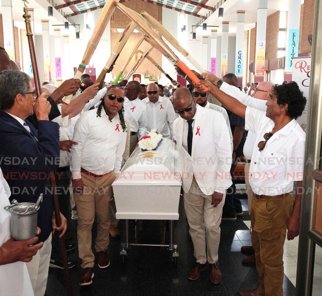 Bats are raised in a guard of honour as pallbearers carry the casket following the funeral for former West Indies and TT cricketer Bernard Julien, on October 18, at St Finbar’s RC Church, Diego Martin. - Photos by Faith Ayoung (Image obtained at newsday.co.tt) Bats are raised in a guard of honour as pallbearers carry the casket following the funeral for former West Indies and TT cricketer Bernard Julien, on October 18, at St Finbar’s RC Church, Diego Martin. - Photos by Faith Ayoung (Image obtained at newsday.co.tt)