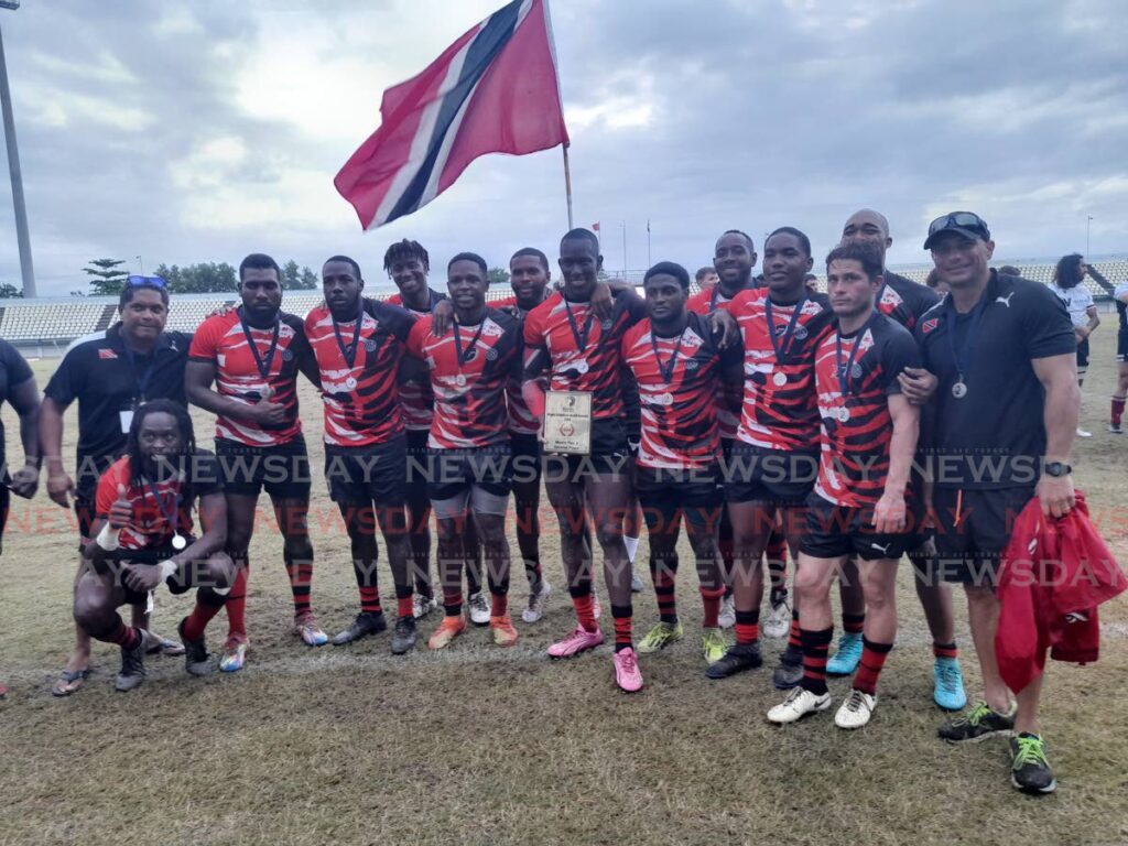 TT men's rugby players and staff after their runner-up finish in the 2024 Rugby Americas North Sevens tournament at Larry Gomes Stadium, Malabar. Photo by Roneil Walcott - (Image obtained at newsday.co.tt) TT men's rugby players and staff after their runner-up finish in the 2024 Rugby Americas North Sevens tournament at Larry Gomes Stadium, Malabar. Photo by Roneil Walcott - (Image obtained at newsday.co.tt)