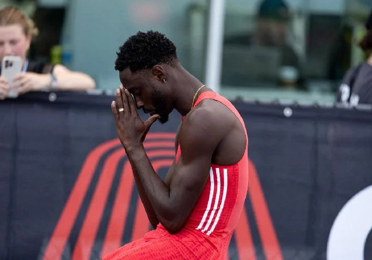 GIVING THANKS: Jereem “The Dream” Richards gives thanks to God following his Grand Slam Track men’s long sprints triumph in Florida, USA, on May 3. --Photo: JEREEM  RICHARDS/FACEBOOK (Image obtained at trinidadexpress.com)