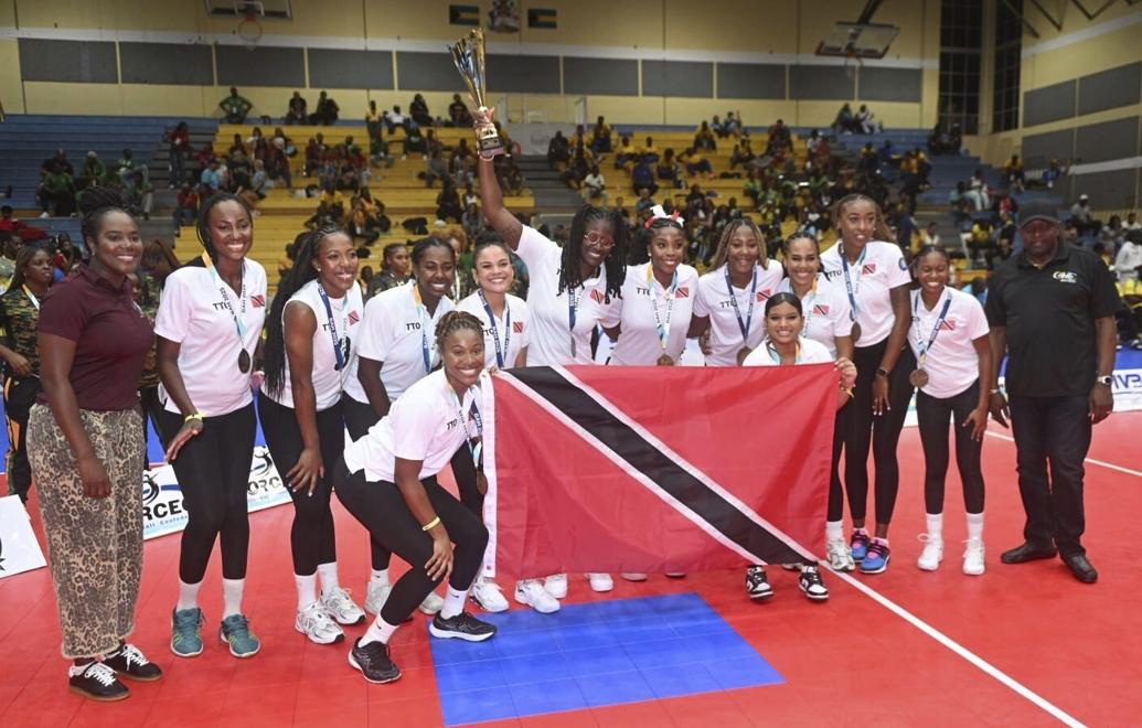 CHAMPS AGAIN: The triumphant T&T women’s volleyball team celebrates their victory in the Caribbean Zonal Volleyball Association (CAZOVA) Championships final against Barbados in the Bahamas on Saturday. —Photo courtesy CAZOVA (Image obtained at trinidadexpress.com) CHAMPS AGAIN: The triumphant T&T women’s volleyball team celebrates their victory in the Caribbean Zonal Volleyball Association (CAZOVA) Championships final against Barbados in the Bahamas on Saturday. —Photo courtesy CAZOVA (Image obtained at trinidadexpress.com)