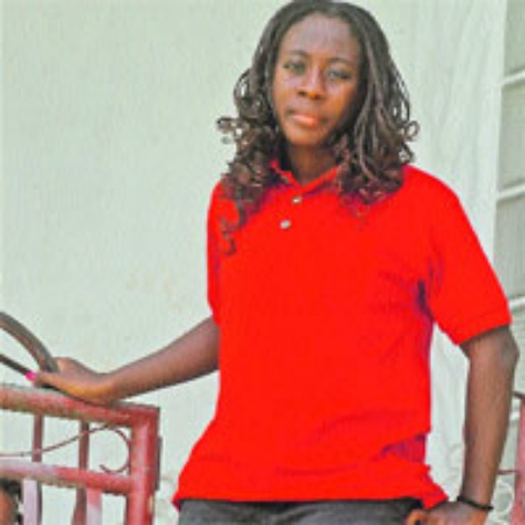 heading to London: Physically challenged national swimmer Shanntol Ince at her Claxton Bay home yesterday. Ince is competing in the London 2012 Paralympics later this month. —Photo: DAVE PERSAD